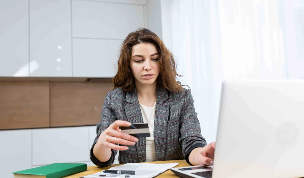 imgi_185_woman-is-relaxing-home-shopping-online-using-laptop-credit-card-1-scaled